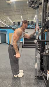 Coach training at cable machine